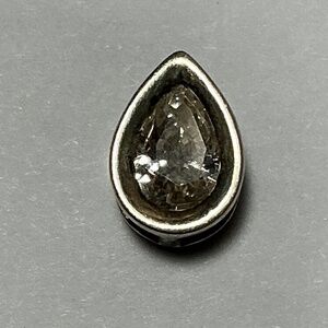 Sterling Silver Teardrop Shaped Pendant with a clear stone. 3/8 inch long